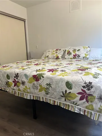 a view of a bedroom with a bed