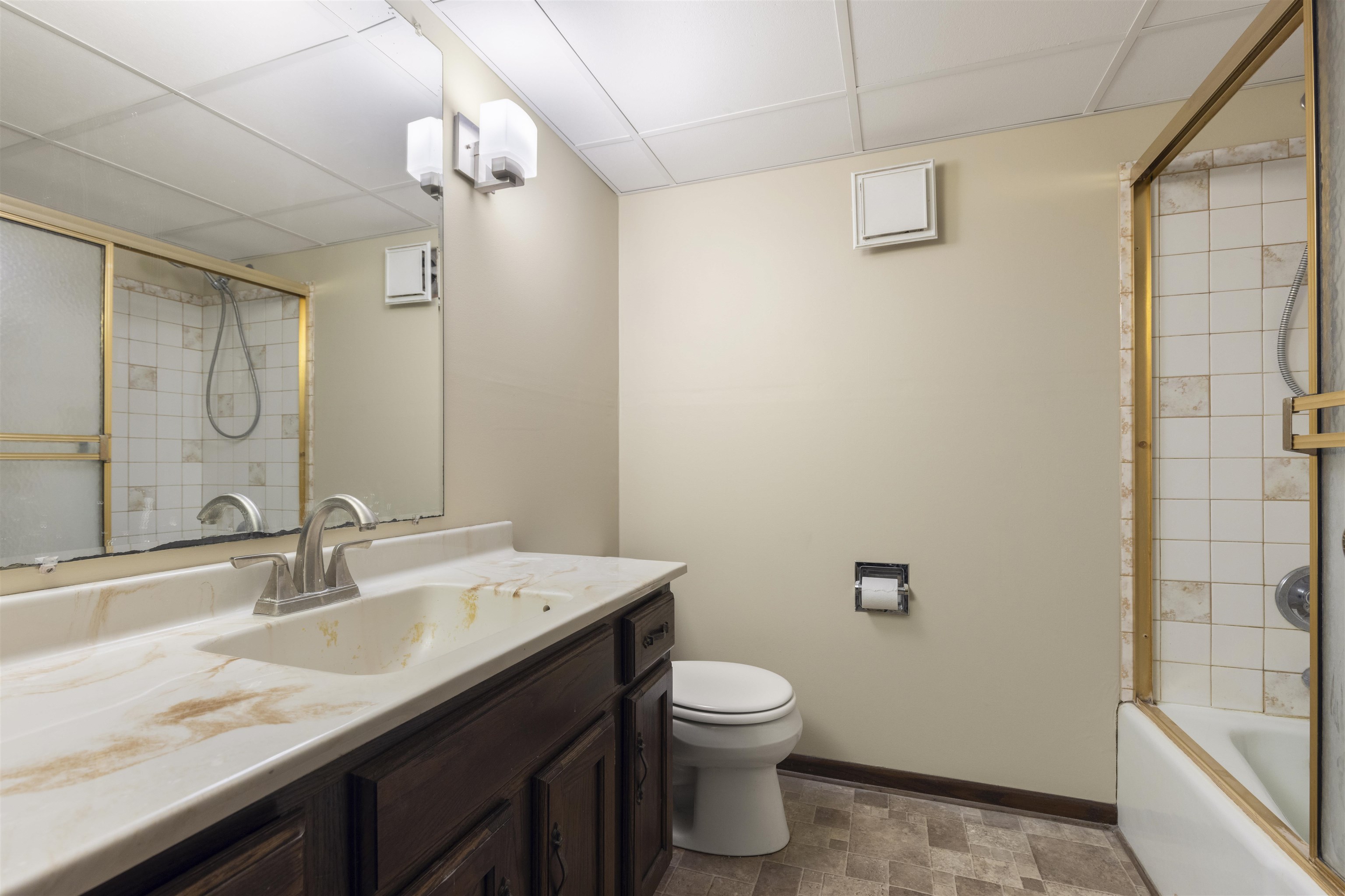464 Valley Forge Trail Rockton, IL 61072 - Photo 16 of 24 a bathroom with a granite countertop sink a toilet and shower
