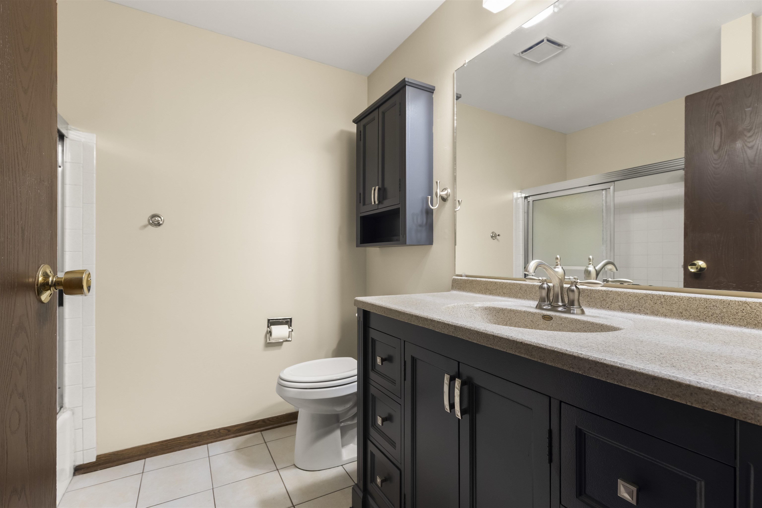464 Valley Forge Trail Rockton, IL 61072 - Photo 9 of 24 a bathroom with a granite countertop sink a toilet and a mirror