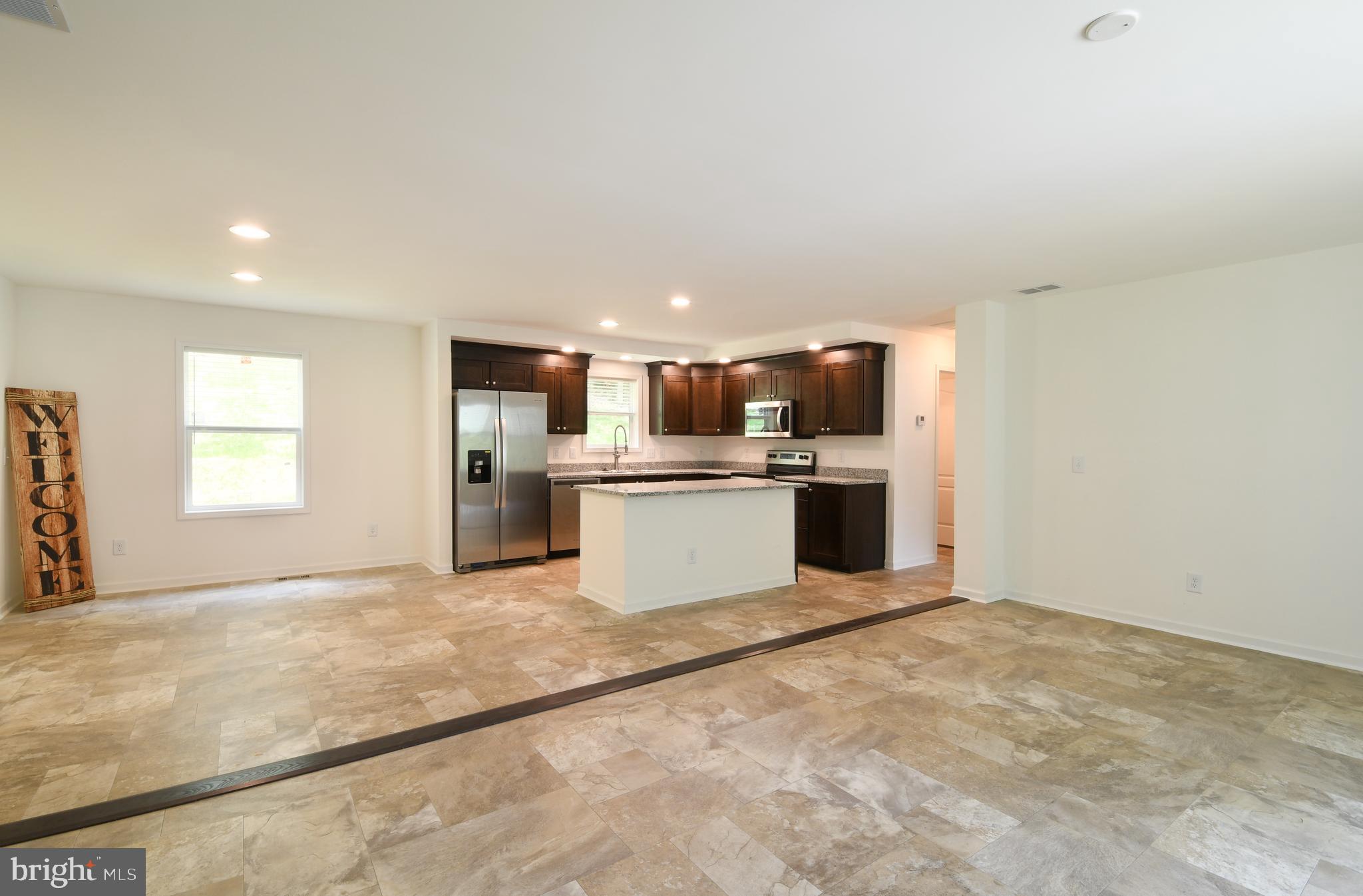 26269 Hill Road Ruther Glen, VA 22546 - Photo 5 of 27 Living Room View into Kitchen/Dinning