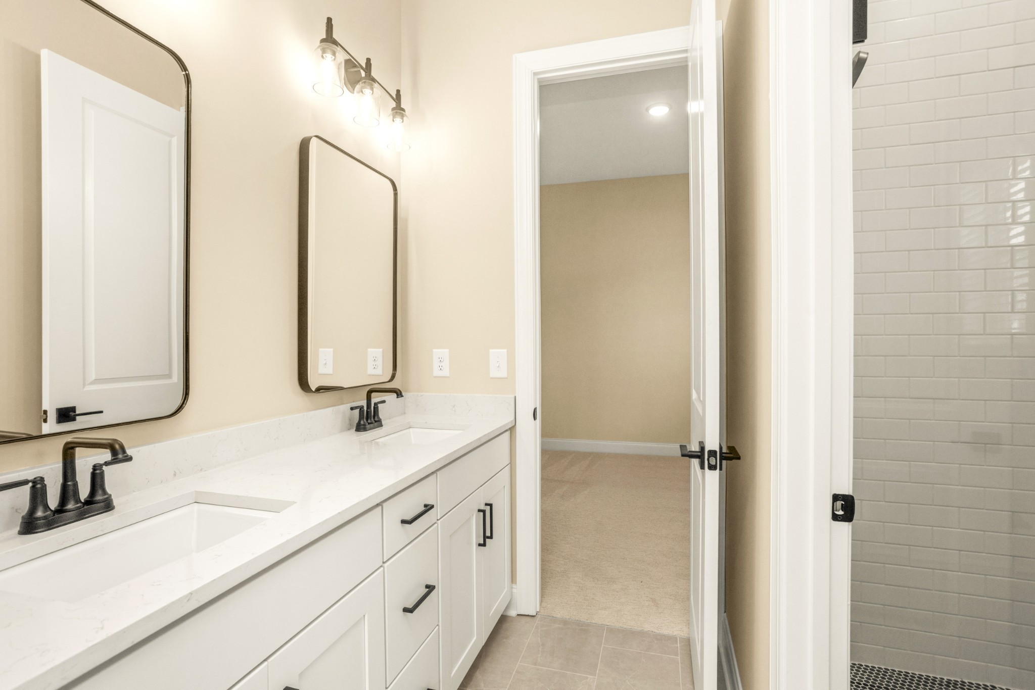 1935 Harmony Road Spring Hill, TN 37174 - Photo 25 of 99 a bathroom with double vanity sink and a mirror