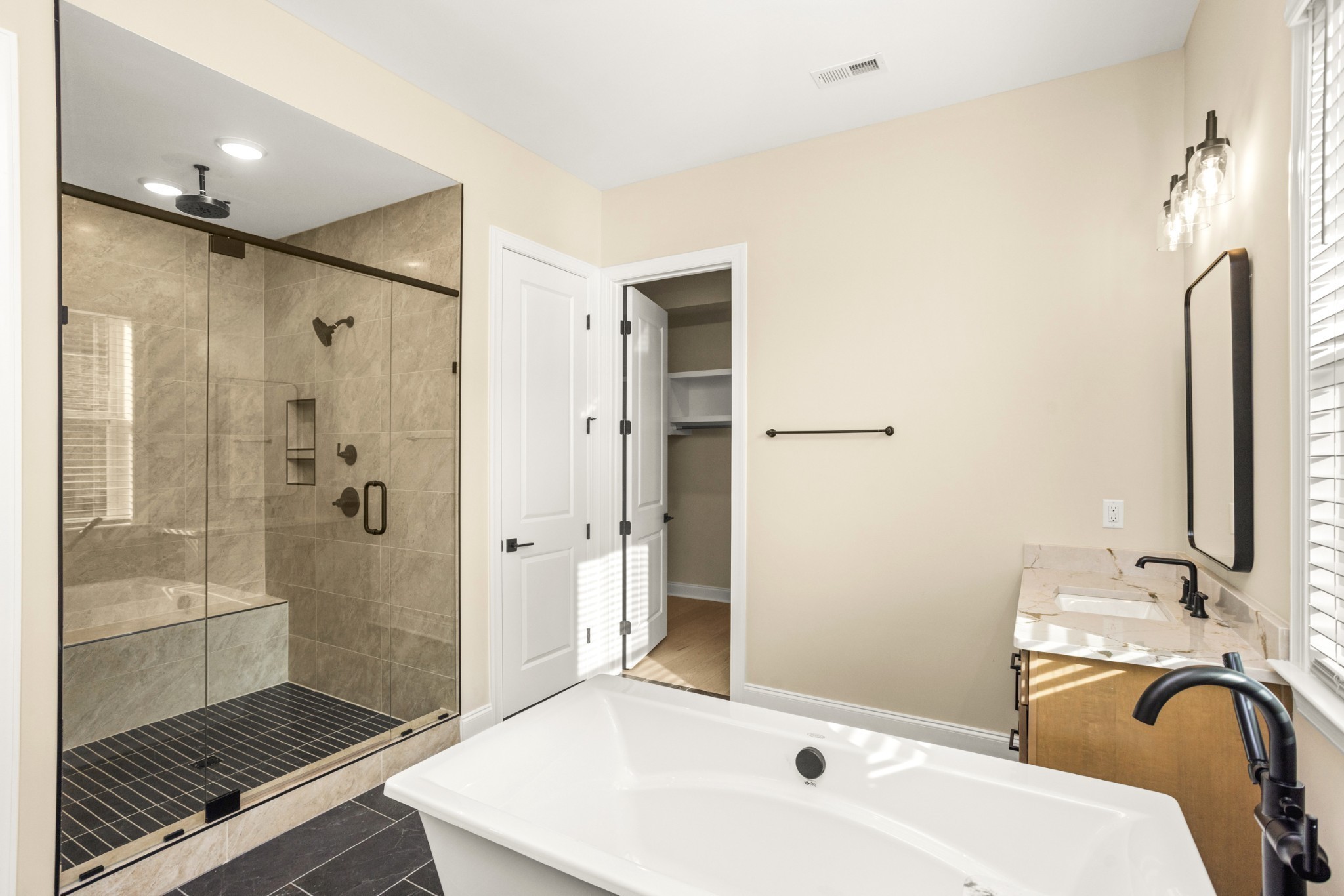 1935 Harmony Road Spring Hill, TN 37174 - Photo 35 of 99 a bathroom with a sink a toilet and shower