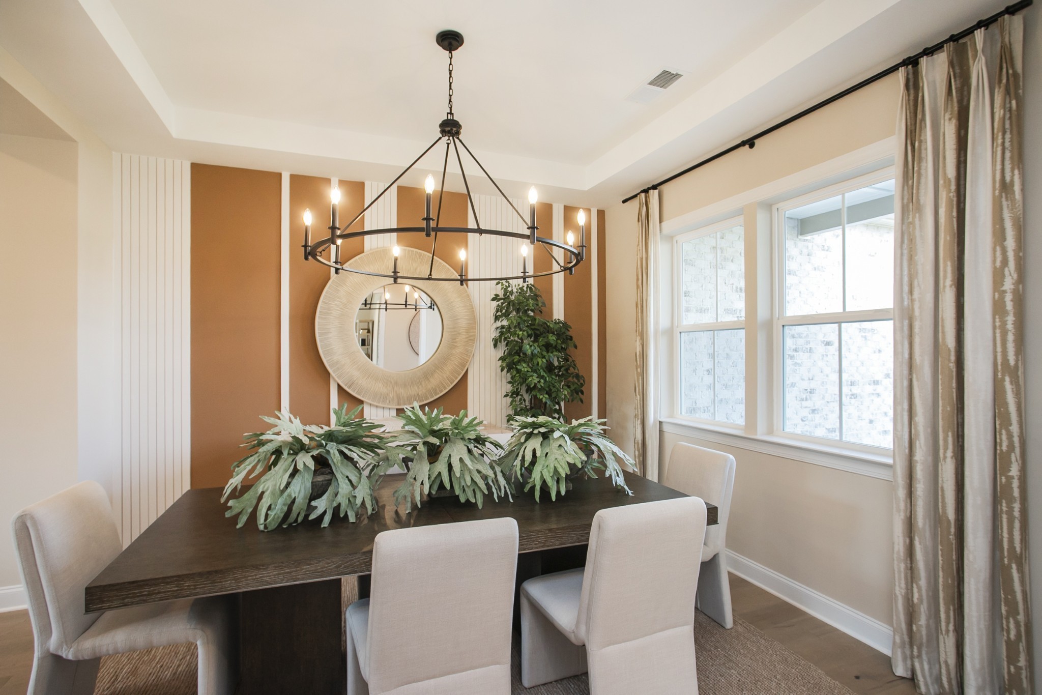 1935 Harmony Road Spring Hill, TN 37174 - Photo 52 of 99 a dining room with furniture potted plants and wooden floor