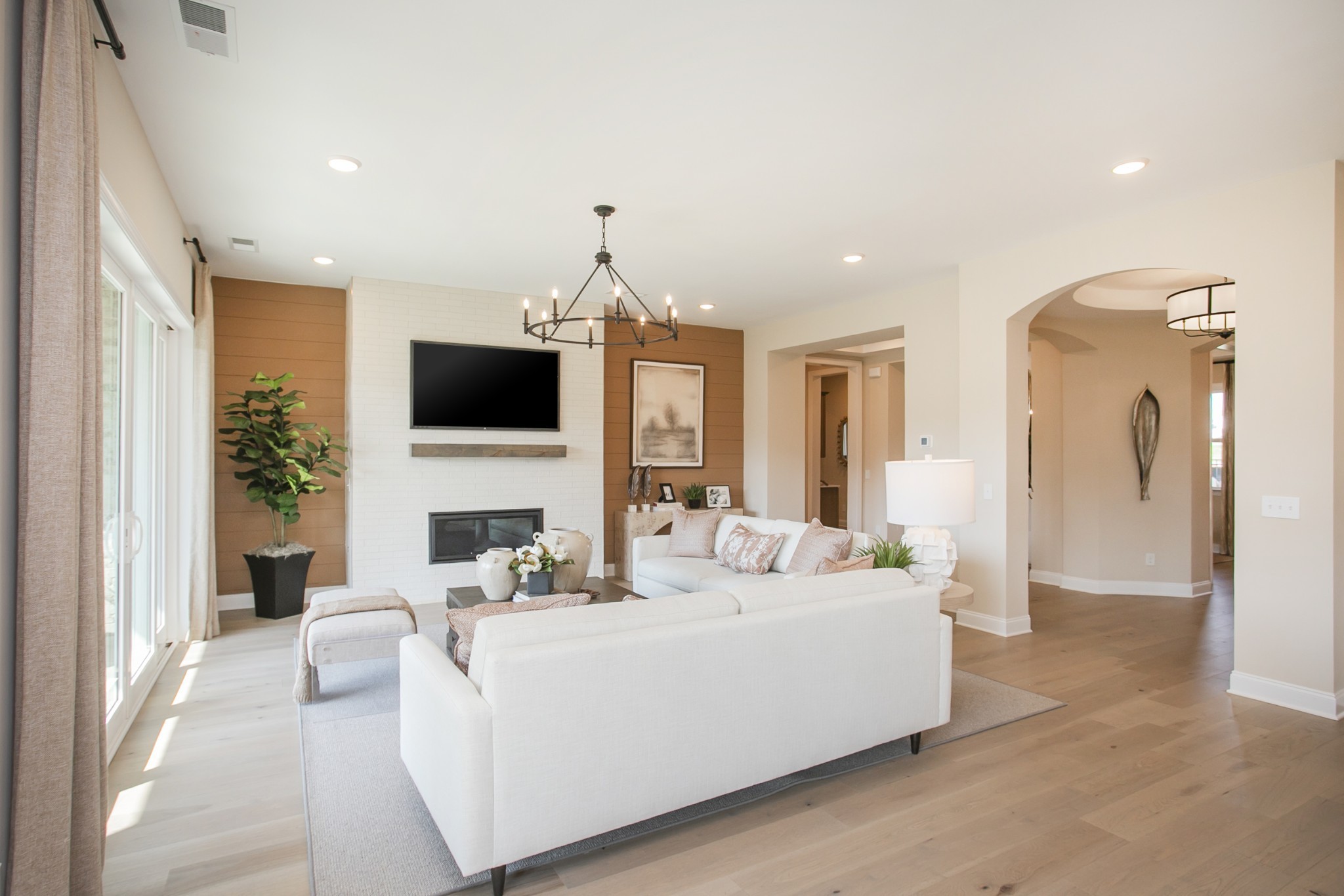 1935 Harmony Road Spring Hill, TN 37174 - Photo 57 of 99 a living room with furniture a fireplace and a flat screen tv