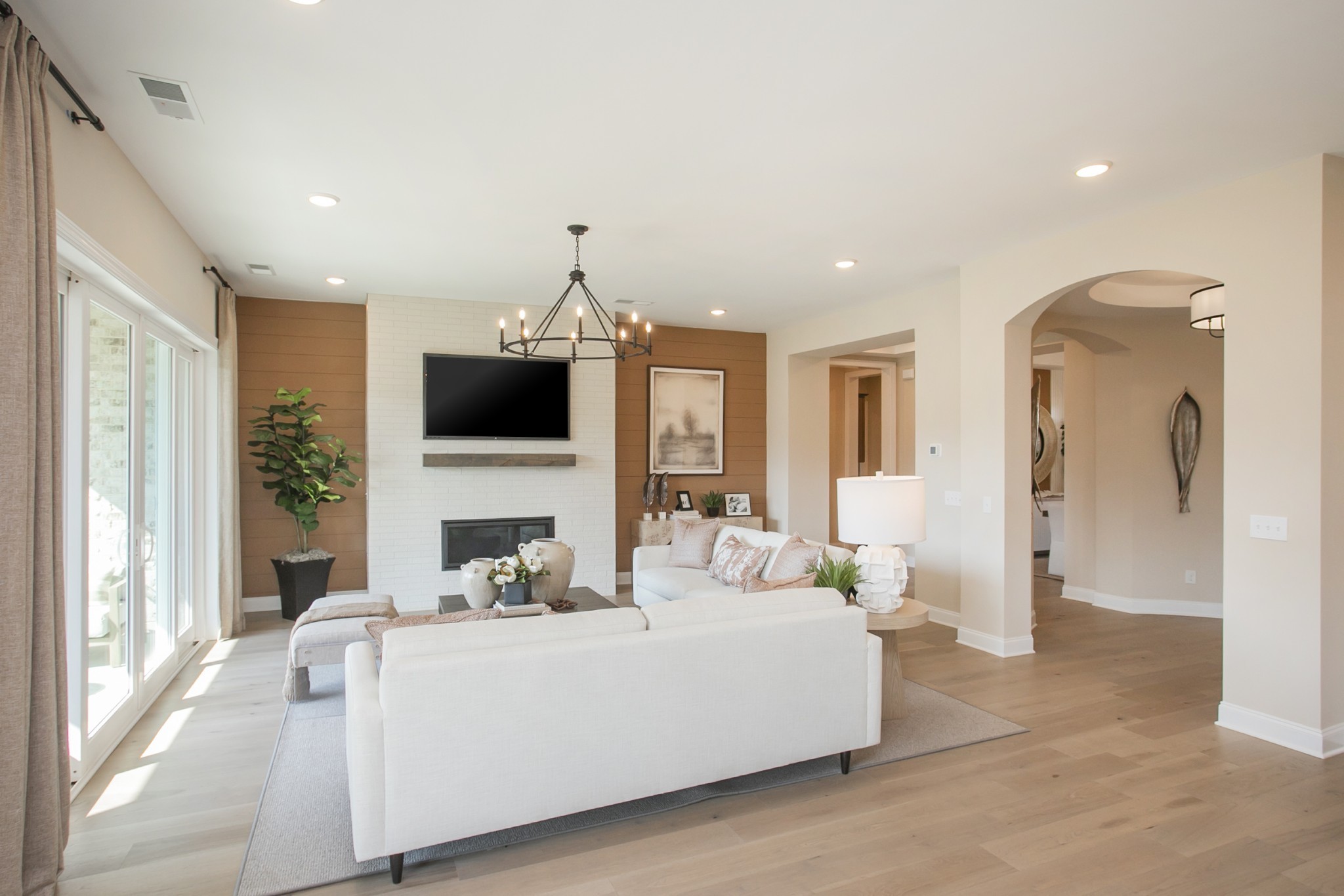 1935 Harmony Road Spring Hill, TN 37174 - Photo 59 of 99 a living room with furniture a flat screen tv and a fireplace