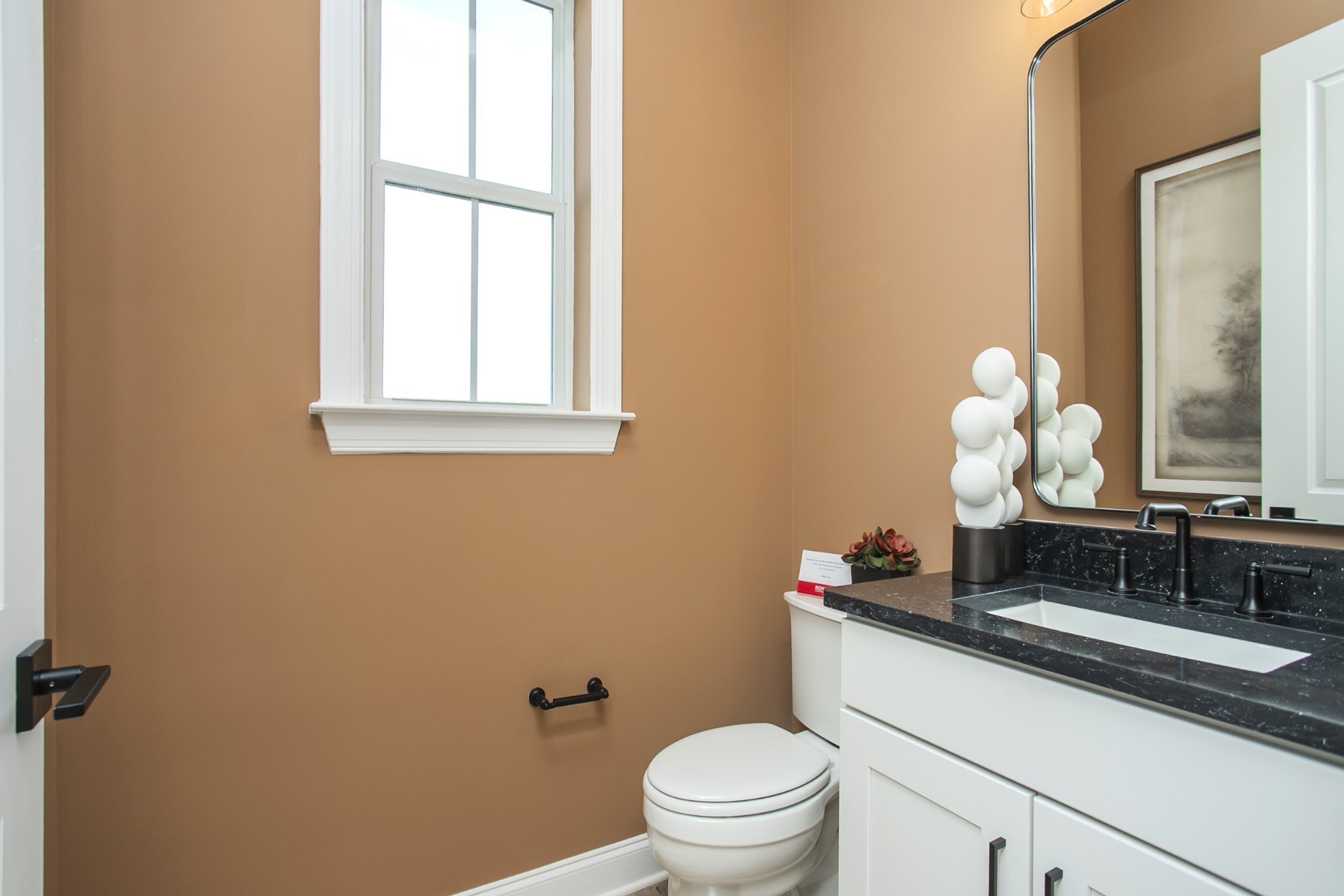 1935 Harmony Road Spring Hill, TN 37174 - Photo 82 of 99 a bathroom with a toilet a sink and a mirror