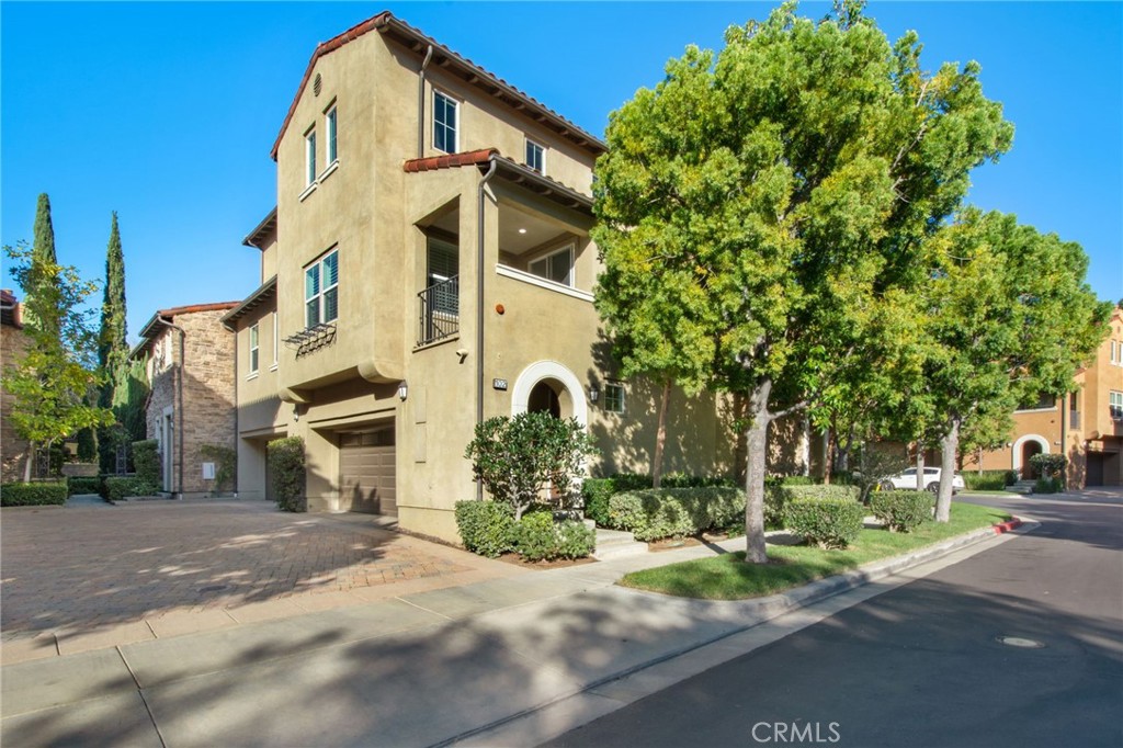 a front view of a building with a yard