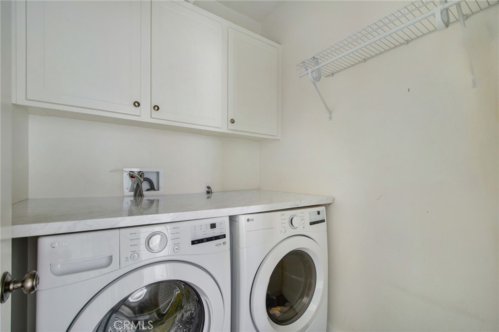 102 Roadrunner Irvine, CA 92603 - Photo 13 of 20 a utility room with dryer and washer