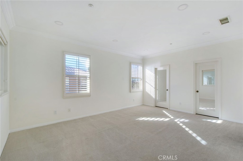 102 Roadrunner Irvine, CA 92603 - Photo 6 of 20 a view of an empty room with a window
