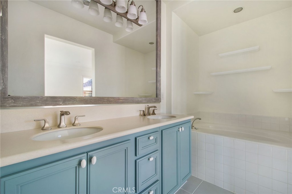 102 Roadrunner Irvine, CA 92603 - Photo 8 of 20 a bathroom with a sink and a mirror