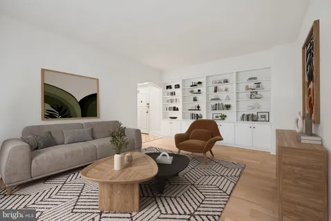 a living room with furniture and a rug