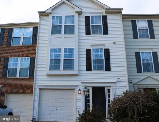 a view of brick house with large windows