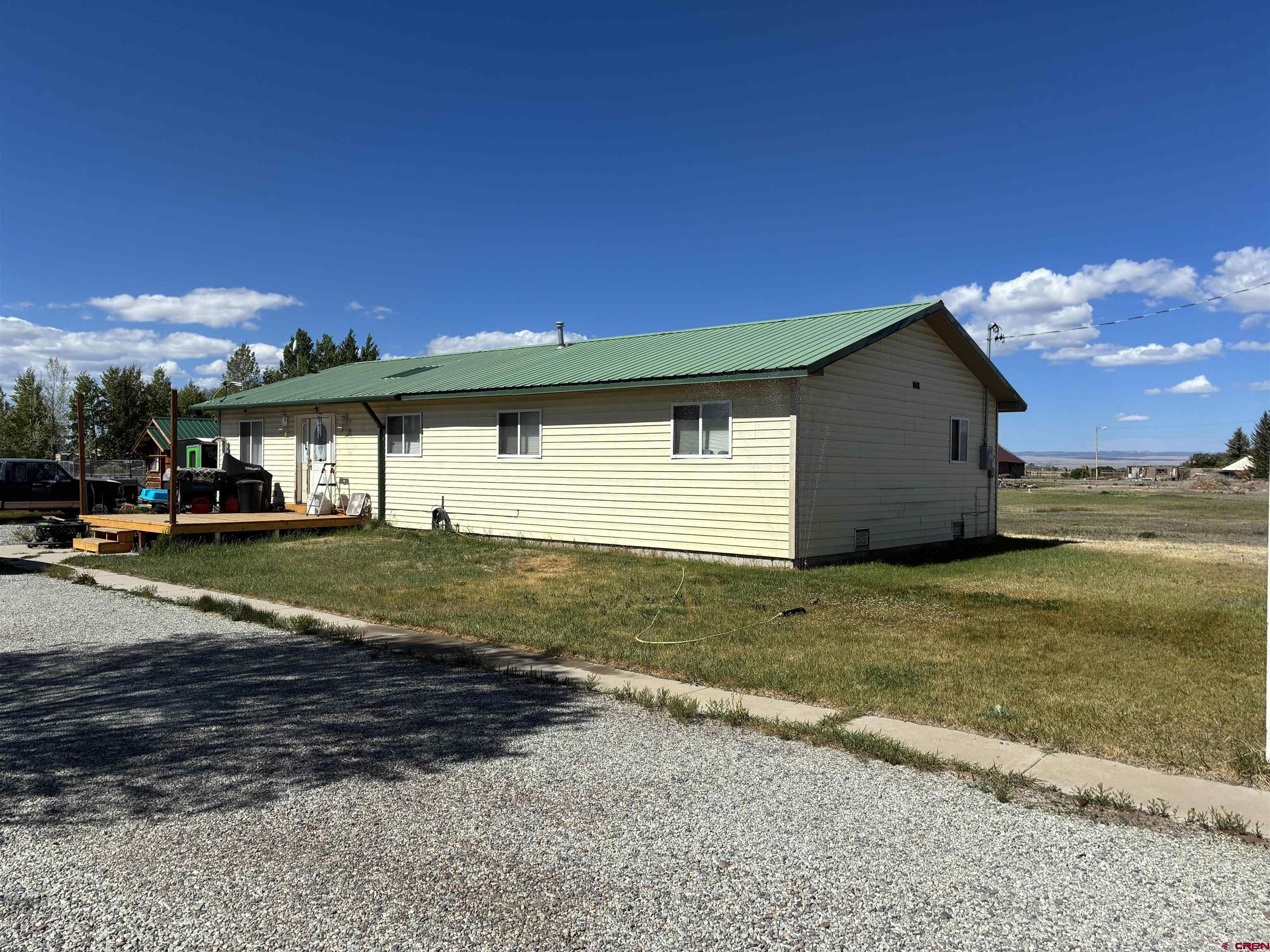 816 Main Street Manassa, CO 81141 - Photo 1 of 23 a view of a house with a yard