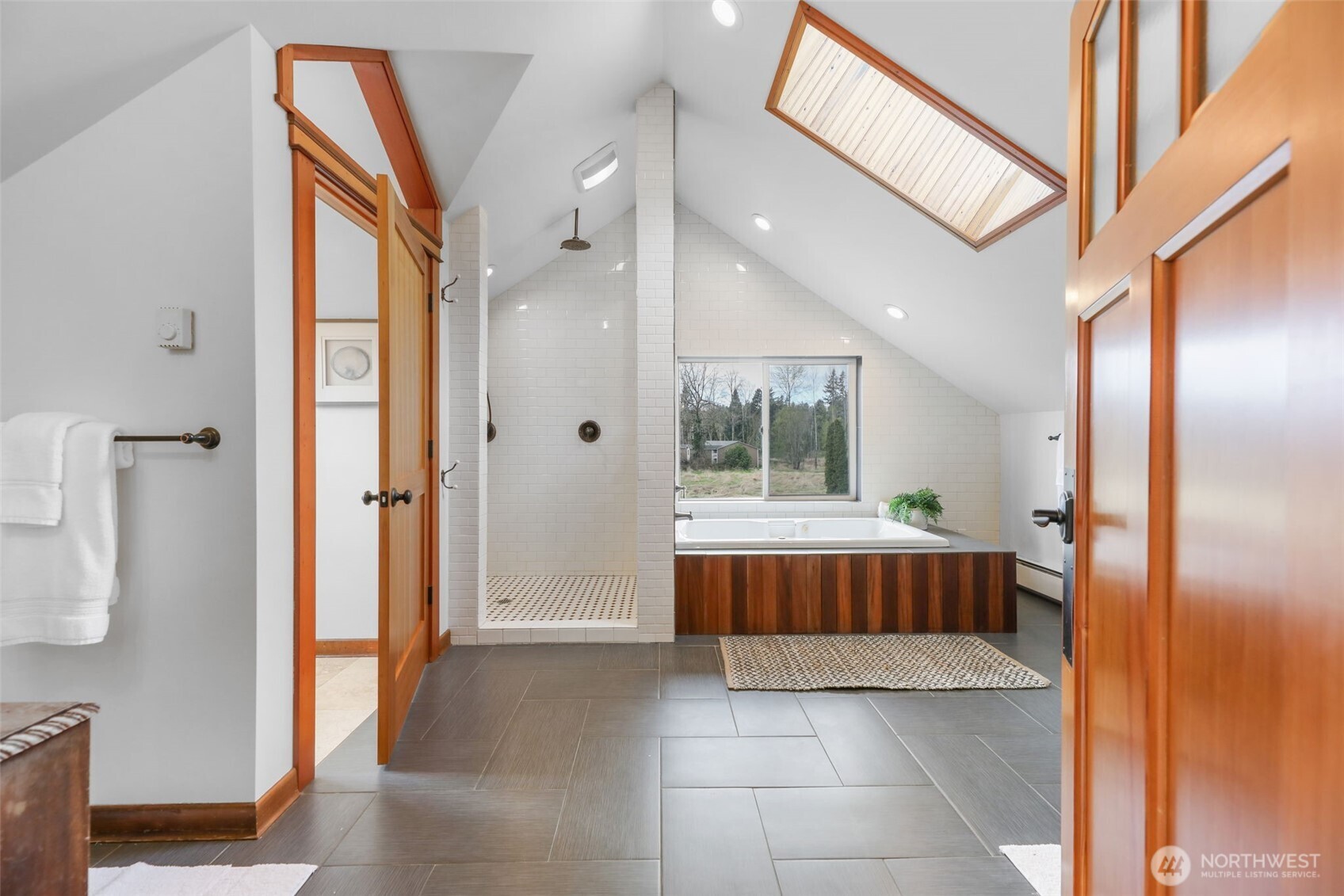 2418 Callow Road Lake Stevens, WA 98258 - Photo 20 of 40 a bathroom with a tub shower and window