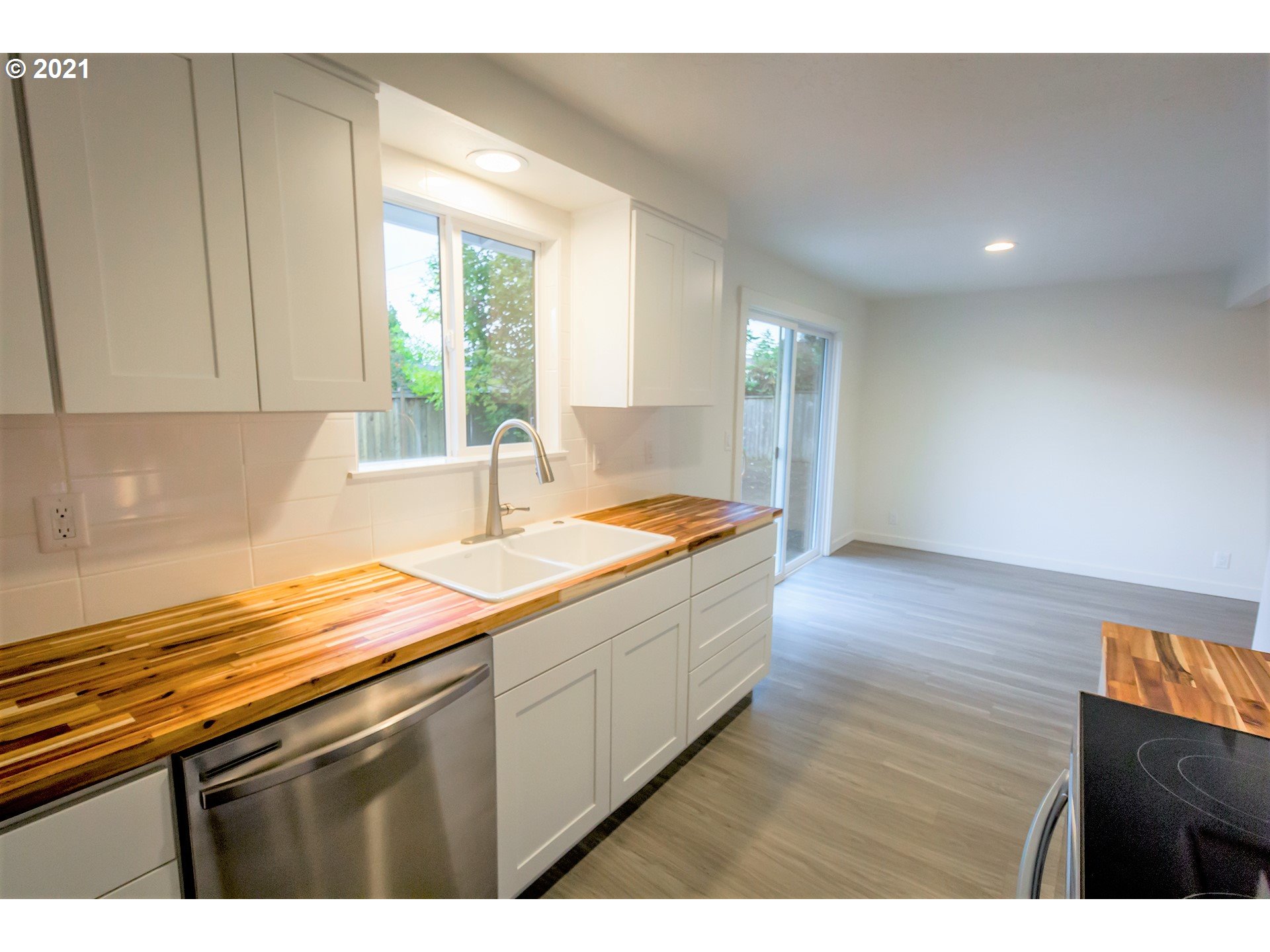 2302 Grovedale Drive Springfield, OR 97477 - Photo 18 of 29 a kitchen with a sink and cabinets