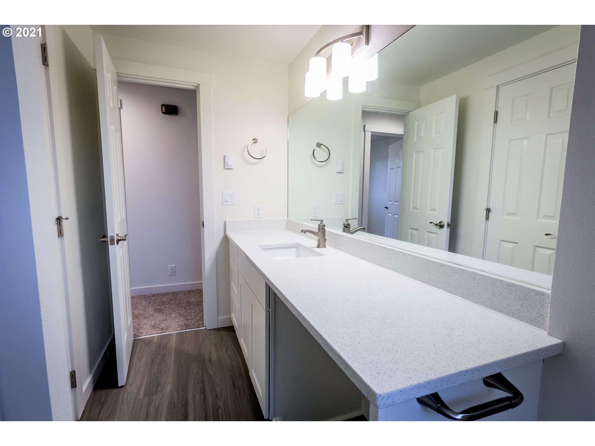 2302 Grovedale Drive Springfield, OR 97477 - Photo 20 of 29 a bathroom with a sink a vanity and a mirror