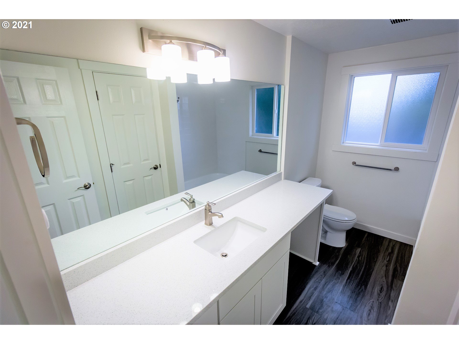 2302 Grovedale Drive Springfield, OR 97477 - Photo 21 of 29 a bathroom with a sink a toilet and a mirror