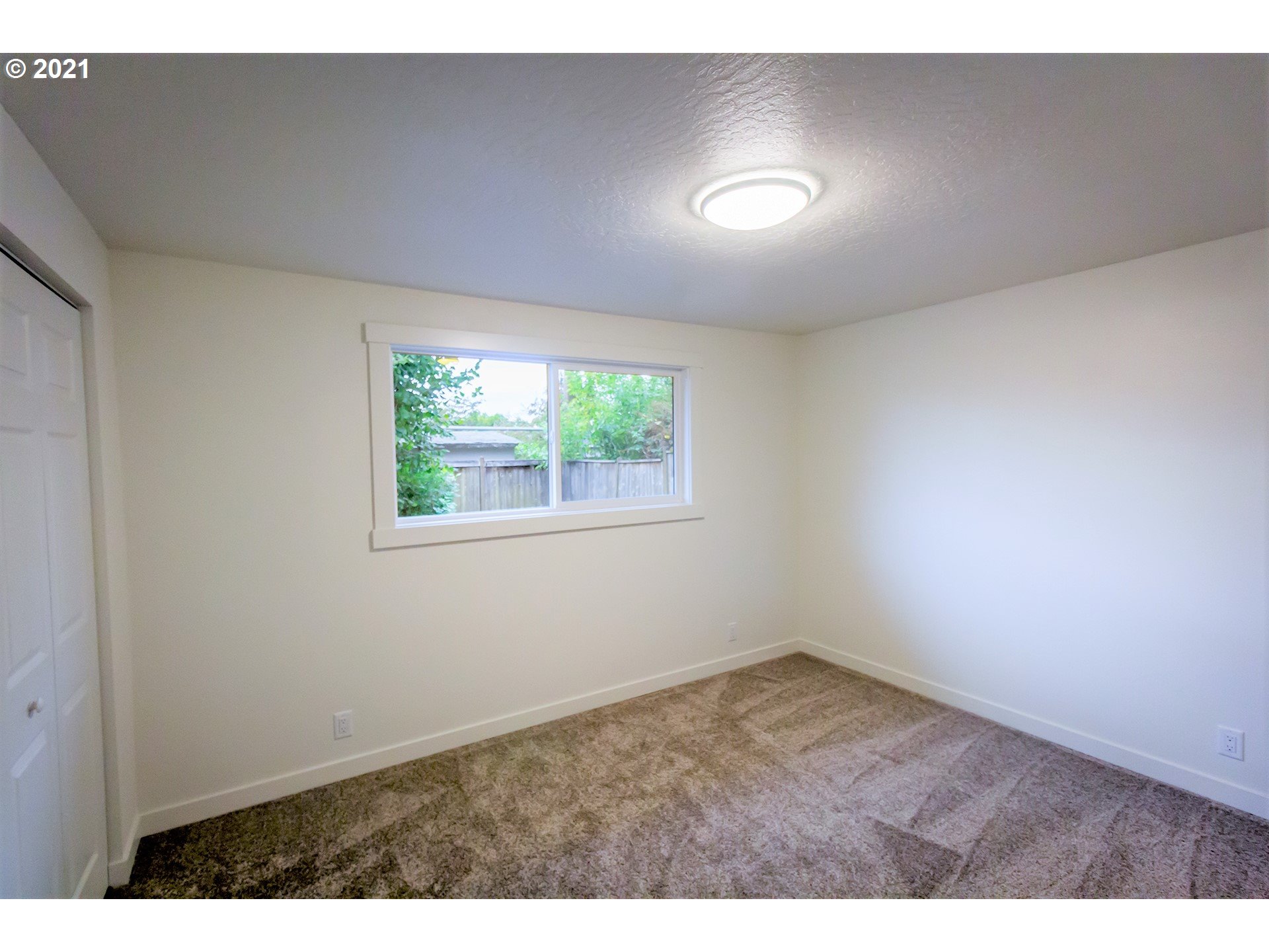 2302 Grovedale Drive Springfield, OR 97477 - Photo 27 of 29 a view of an empty room with a window