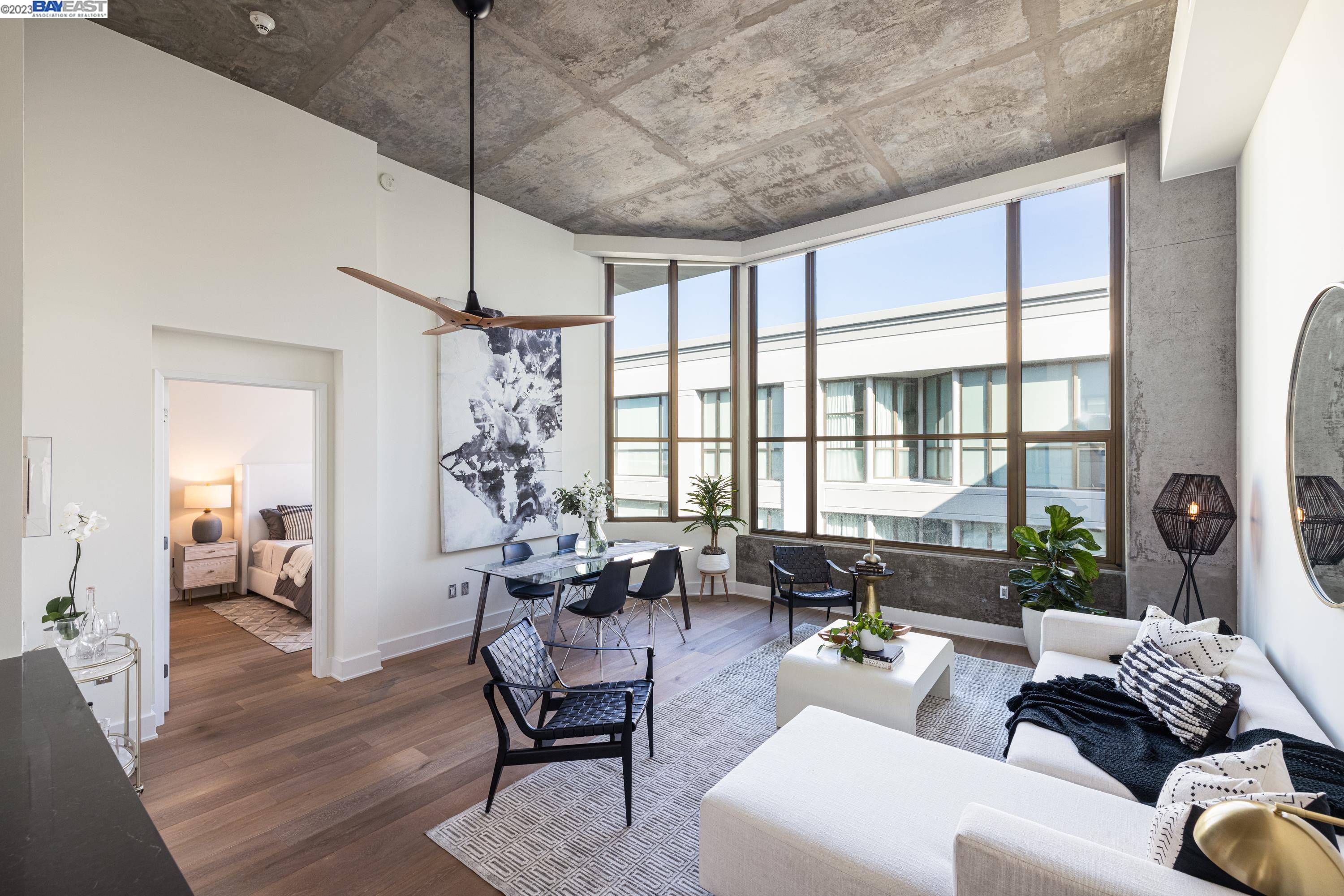 311 2nd Street, Unit 804 Oakland, CA 94607 - Photo 4 of 17 a living room with furniture and a large window