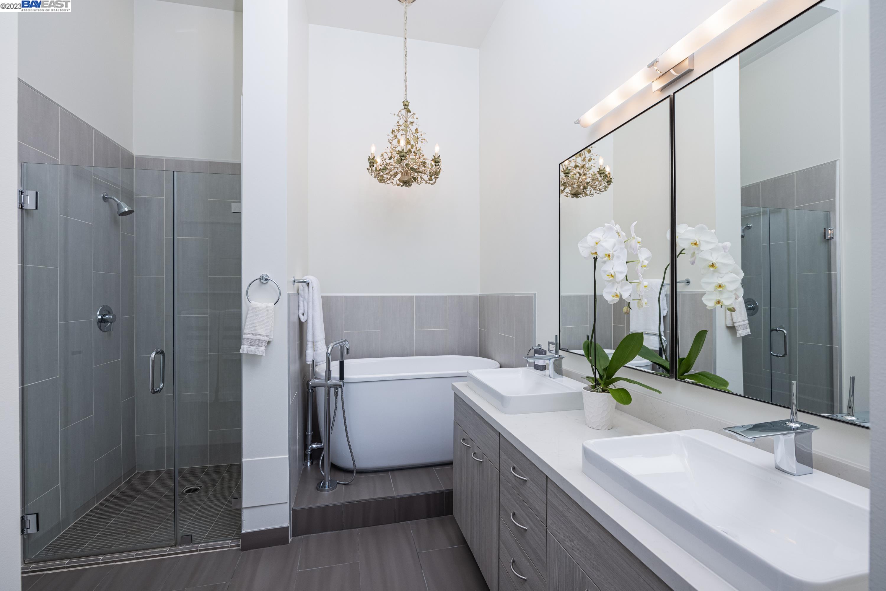 311 2nd Street, Unit 804 Oakland, CA 94607 - Photo 5 of 17 a bathroom with a tub sink and mirror