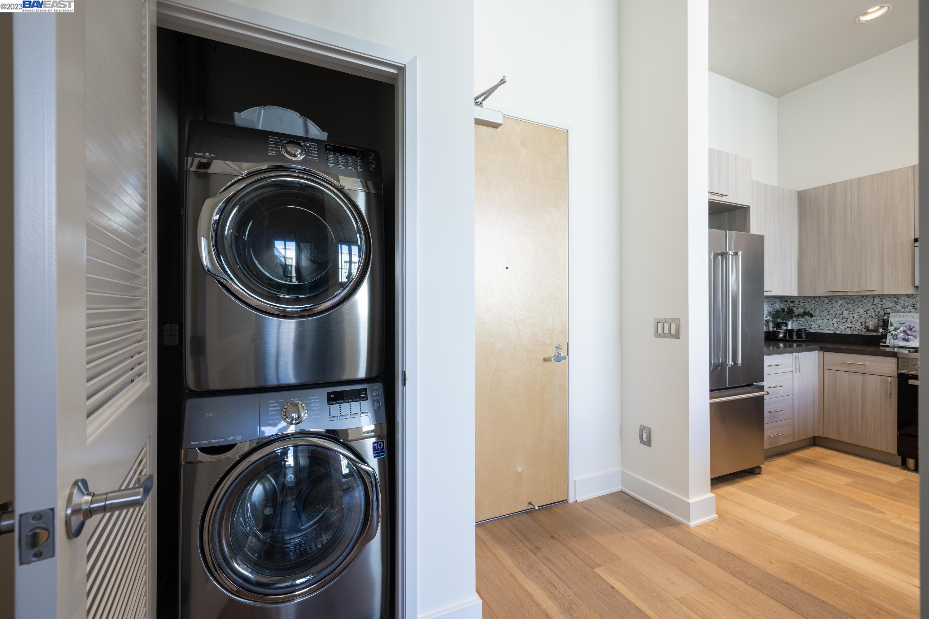 311 2nd Street, Unit 804 Oakland, CA 94607 - Photo 7 of 17 a view of a kitchen with washer and dryer