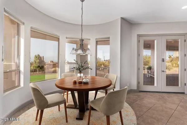 a view of a dining room with furniture window and outside view