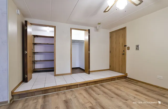 a view of an empty room with a fireplace