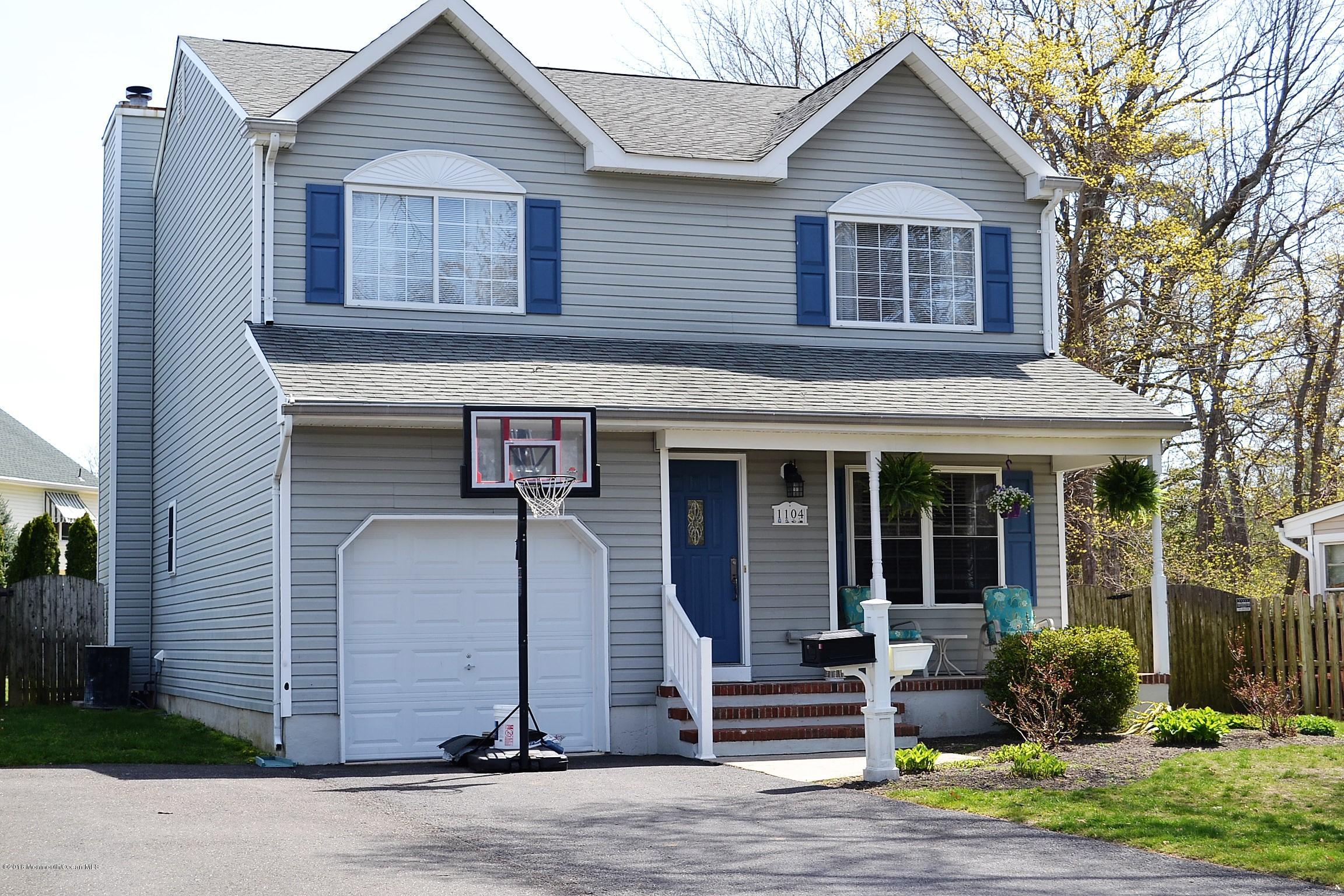 1104 Old Drift Road Point Pleasant, NJ 08742 - Photo 1 of 24 a front view of a house with garden