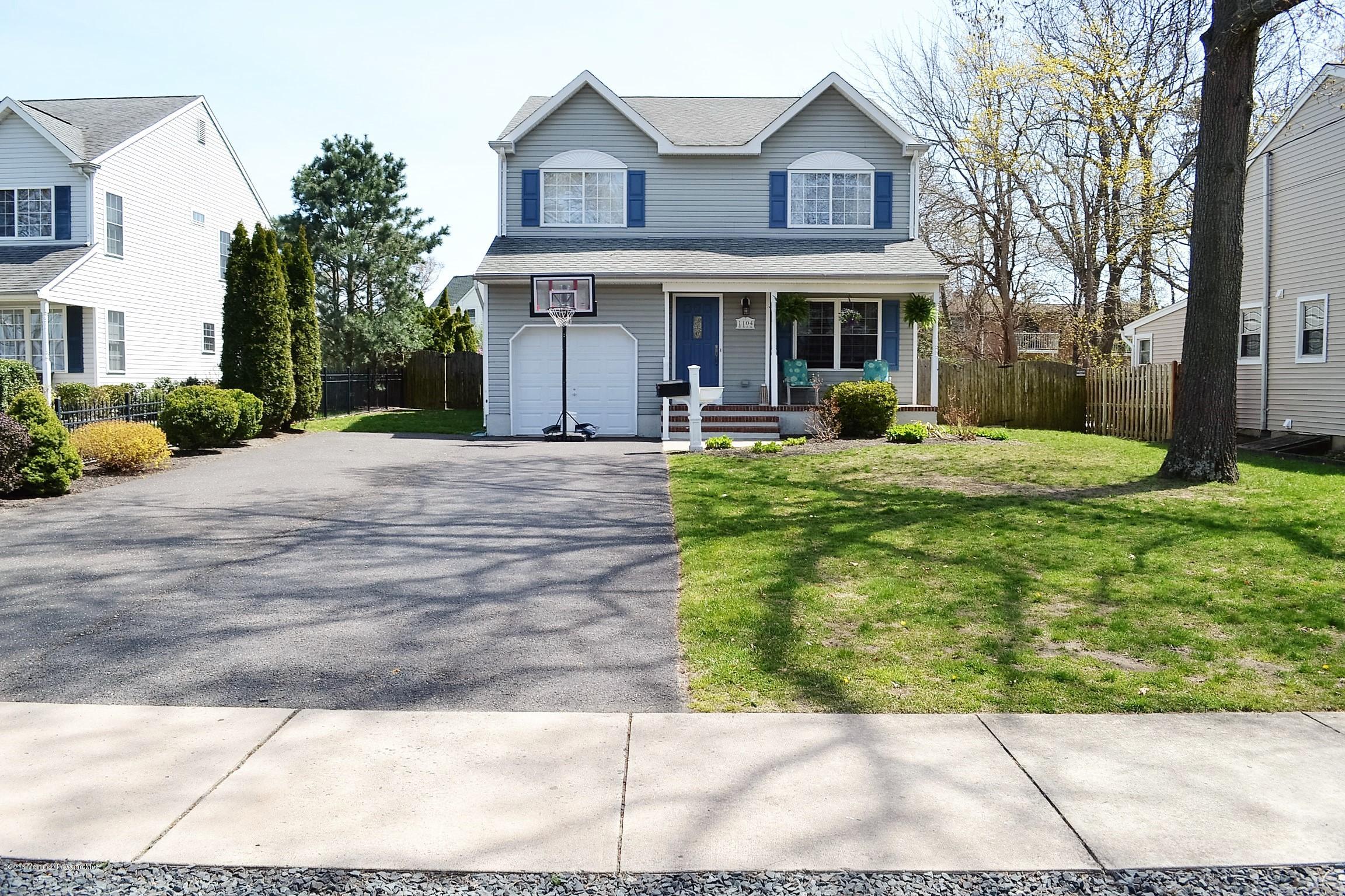 1104 Old Drift Road Point Pleasant, NJ 08742 - Photo 3 of 24 a front view of a house with yard and green space