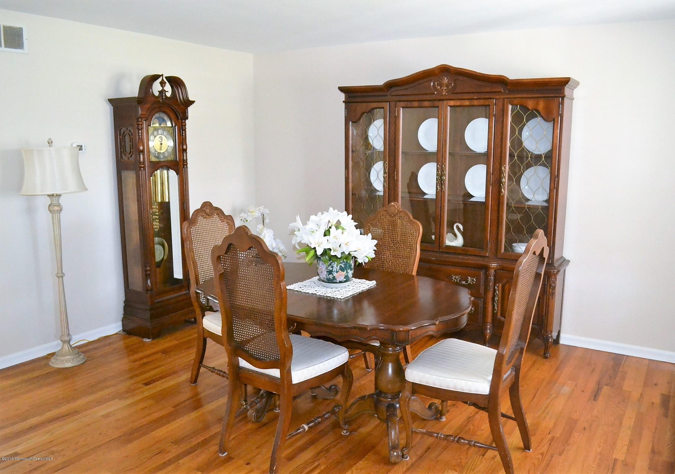 1104 Old Drift Road Point Pleasant, NJ 08742 - Photo 4 of 24 a view of a dining room with furniture and wooden floor