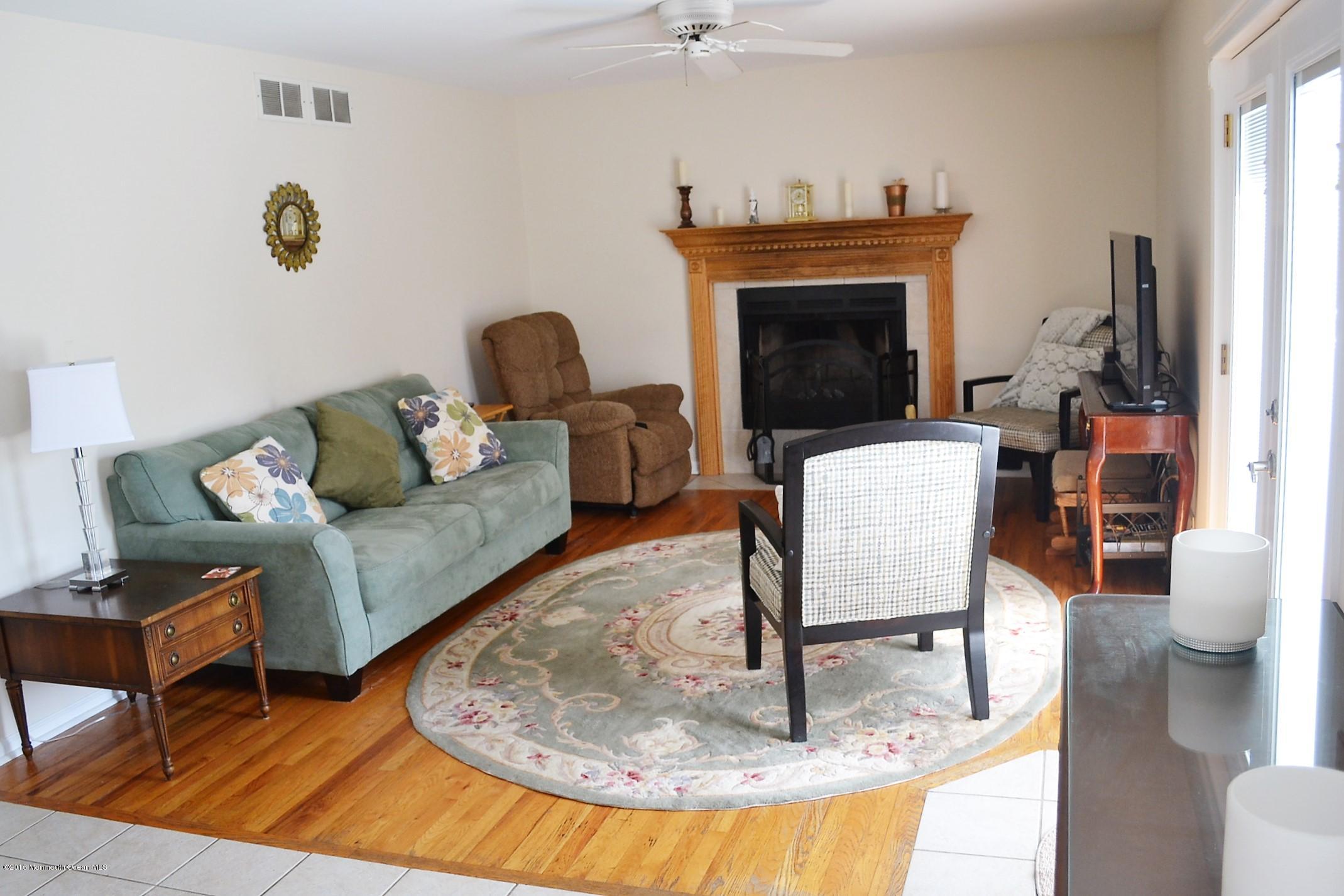 1104 Old Drift Road Point Pleasant, NJ 08742 - Photo 5 of 24 a living room with furniture and a fireplace