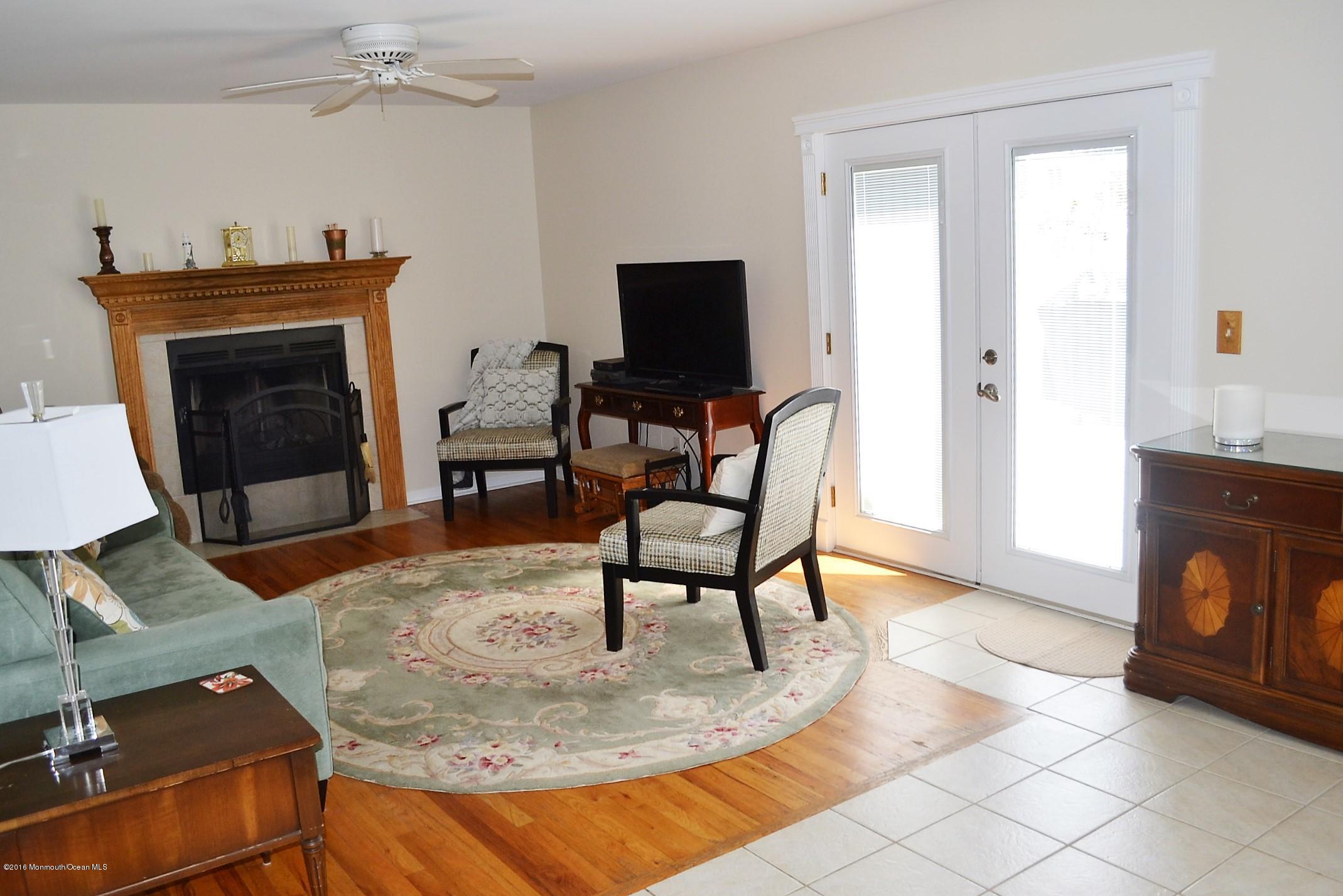 1104 Old Drift Road Point Pleasant, NJ 08742 - Photo 9 of 24 a living room with furniture and a fireplace