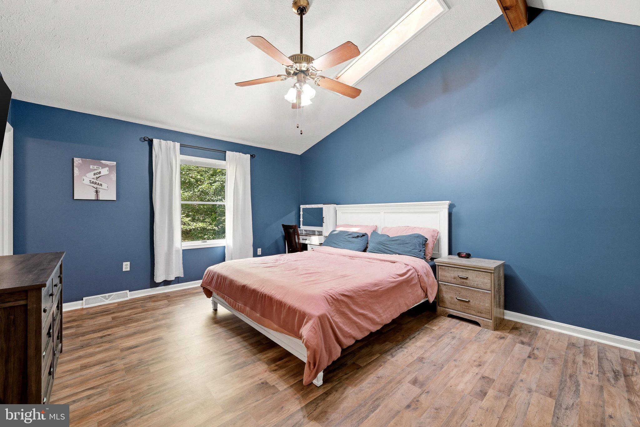 150 Holiday Road Cross Junction, VA 22625 - Photo 40 of 97 Gorgeous primary bedroom w/ vaulted ceilings