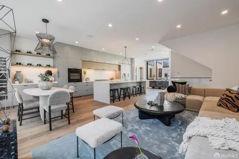 a large kitchen with granite countertop a lot of counter space and a sink