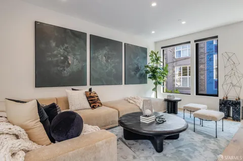 a kitchen with stainless steel appliances granite countertop a stove and refrigerator