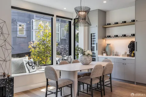 a kitchen with a stove a sink and a refrigerator