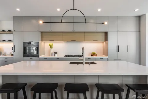 a spacious bedroom with a bed and a walk in closet