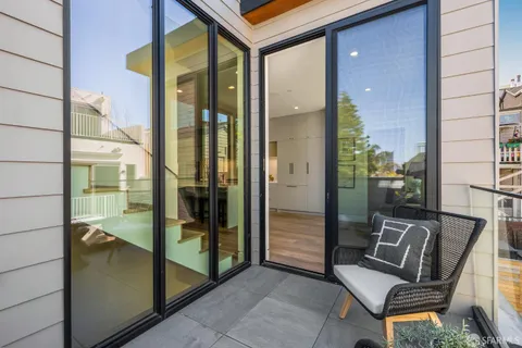 a bedroom with a bed and a potted plant