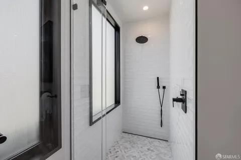 a bedroom with a bed and dresser