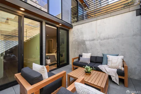 a view of a chairs and table on the terrace