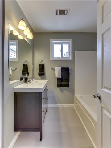 2951 Ivey Point Road Goodlettsville, TN 37072 - Photo 12 of 20 You feel like you're in a Spa in both of the Renovated Bathrooms! Sleek Vanity, Tiled Floors, Large Mirror, Upgraded Lighting