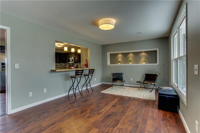 2951 Ivey Point Road Goodlettsville, TN 37072 - Photo 3 of 20 Handscraped Hardwood Floors and check out all the Custom Lighting. Bar pass through to the kitchen creates an Open Concept. A True Entertainer's Dream!