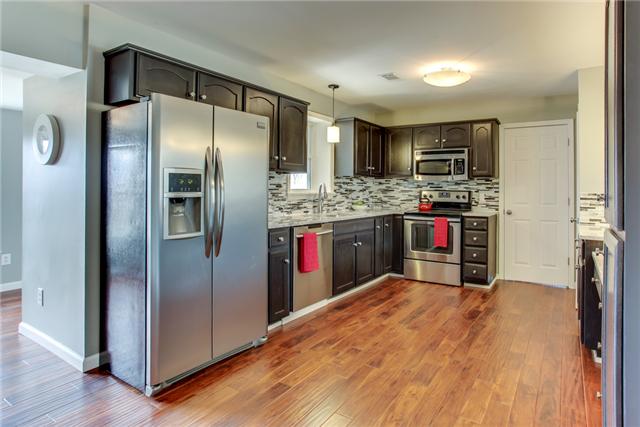 2951 Ivey Point Road Goodlettsville, TN 37072 - Photo 6 of 20 Stainless French Door Refrigerator, Gooseneck Faucet, Custom Tile Backsplash. Your friends will envy your Renovated Kitchen!