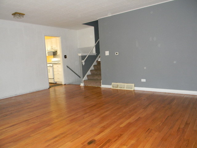 244 North Ridgemoor Avenue Mundelein, IL 60060 - Photo 2 of 10 a view of an empty room with wooden floor and a window