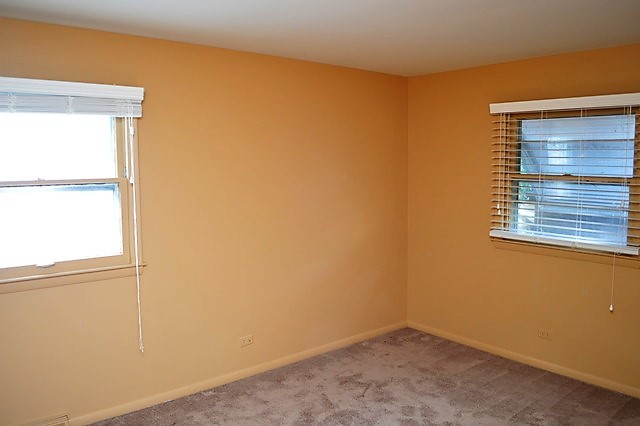 244 North Ridgemoor Avenue Mundelein, IL 60060 - Photo 8 of 10 a view of an empty room with a window