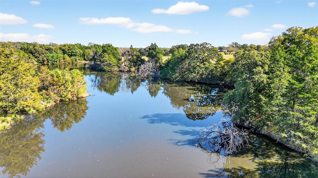912 East Bewley Road Whitesboro, TX 76273 - Photo 24 of 30 a view of a lake with outdoor space