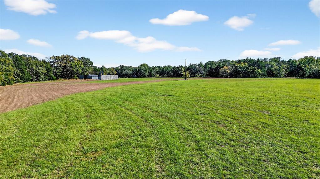 912 East Bewley Road Whitesboro, TX 76273 - Photo 28 of 30 a view of a field of grass and trees