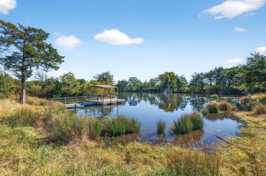 912 East Bewley Road Whitesboro, TX 76273 - Photo 30 of 30 a view of a lake with houses in the back