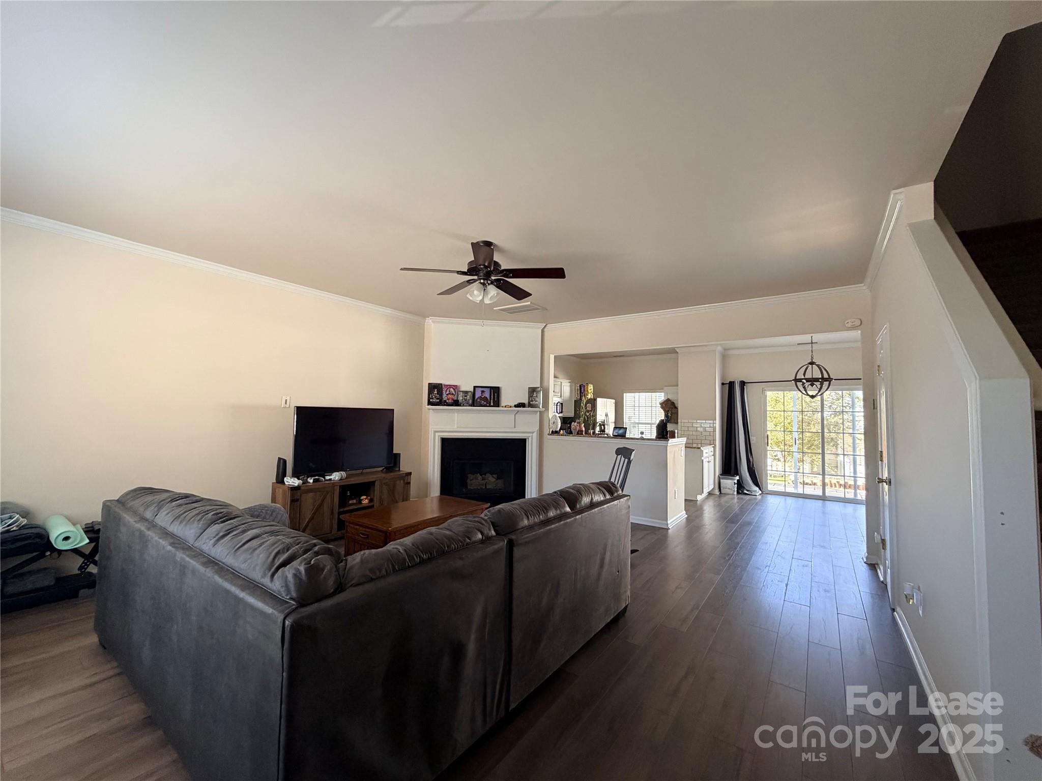 6836 Rothchild Drive Charlotte, NC 28270 - Photo 4 of 25 a living room with furniture and a flat screen tv