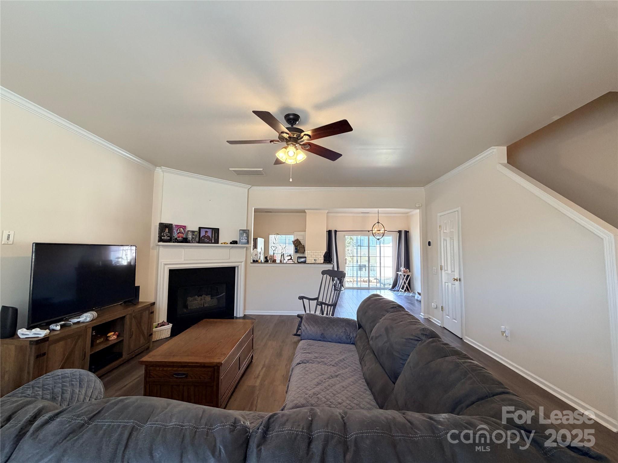 6836 Rothchild Drive Charlotte, NC 28270 - Photo 5 of 25 a living room with furniture and a flat screen tv